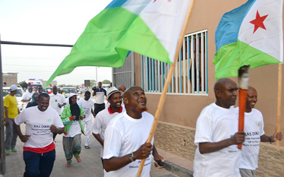 HOLDING FLAGS 