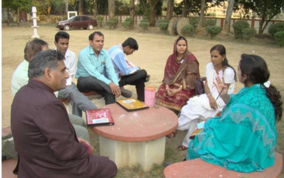 people sitting in a circle and chatting 