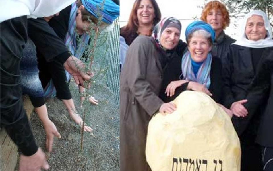 women holding on a rock 