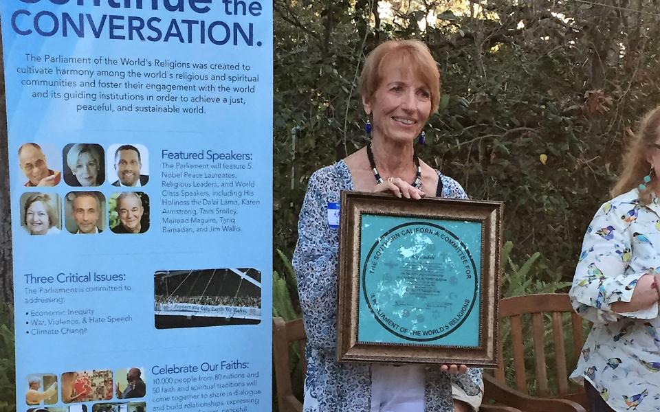 Kay Lindahl with Parliament banner