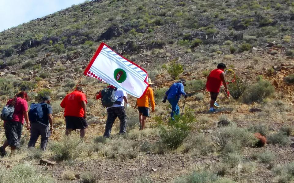 People walking up a hill