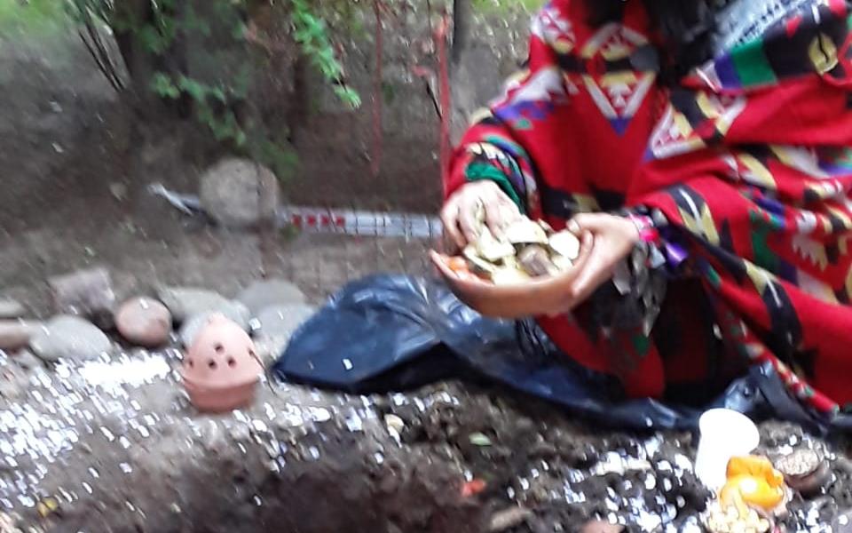 Photo: Rosadelia making an offering to the Pachamama