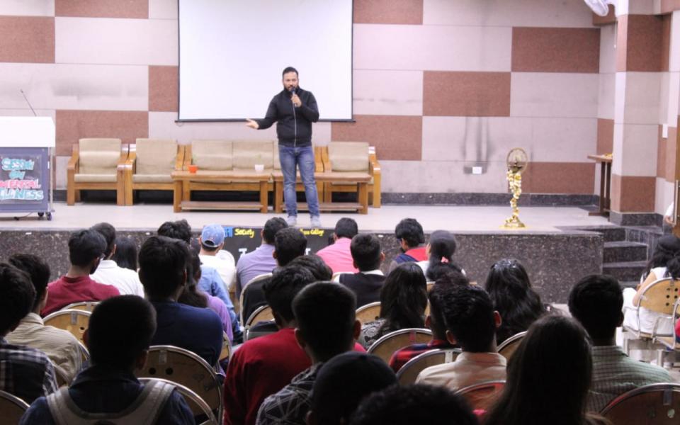 Photo: A man addressing an audience