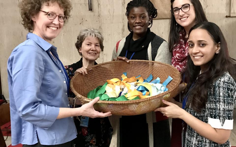 Kendra (second from right) participates in a ceremony at the UN Chapel. 